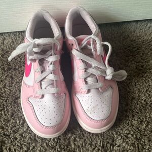 Girls triple pink Nike dunks